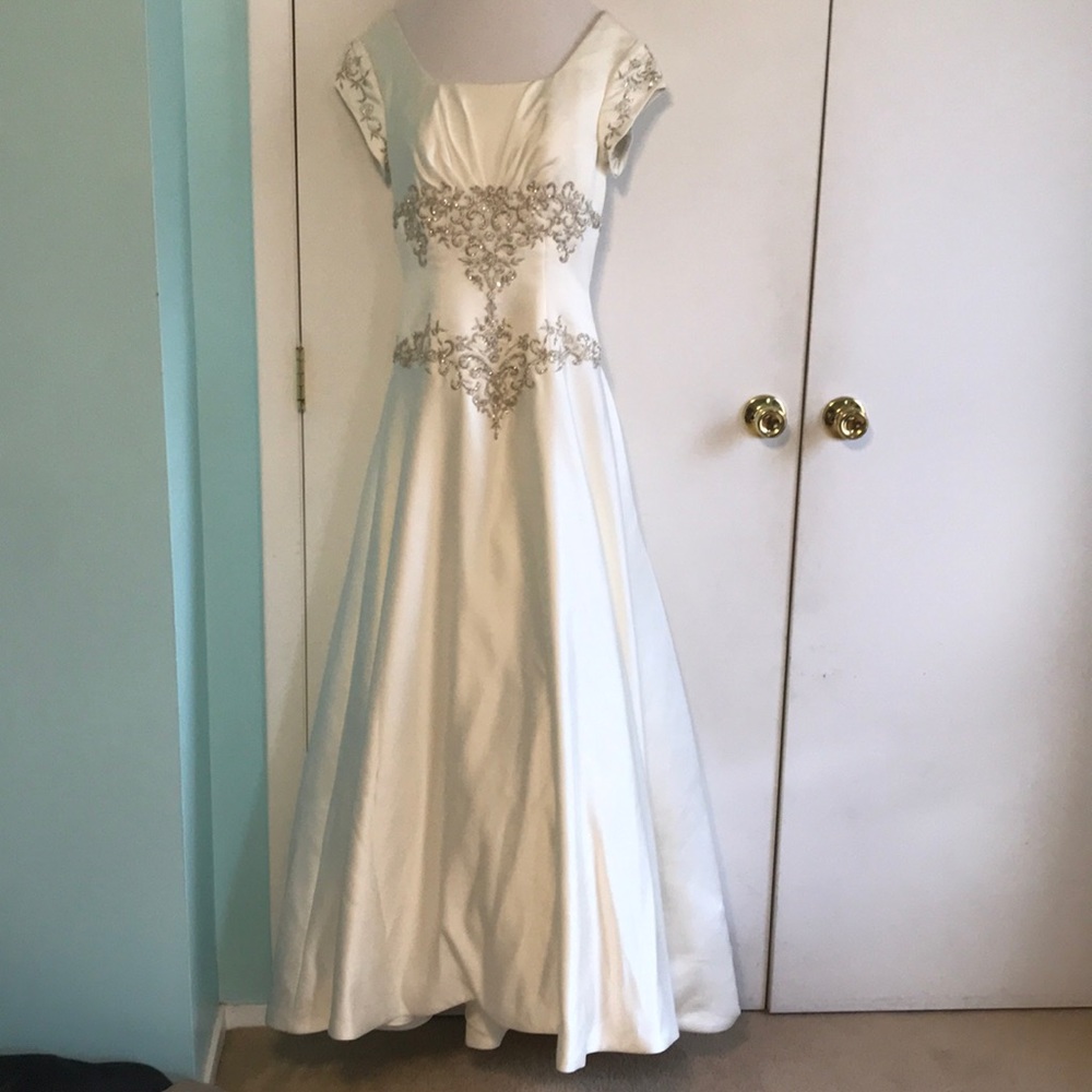 Modest ivory wedding dress with long train